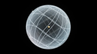 An artistic representation of the hydrogen atom, with a small gold-colored proton in the nucleus and a shell etched out by an orbiting star-like electron