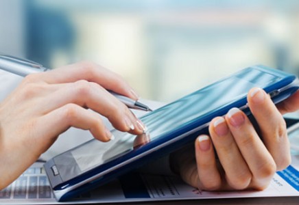 Internal Audit Department person touching a tablet screen